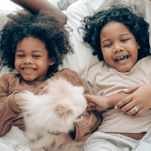Two young black children smiling